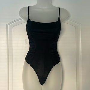 Free people bodysuit black with rouge, detailed sides, thong back NWOT